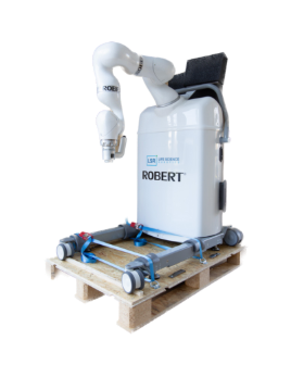 A white robot on a wooden pallet</p>
<p>Description automatically generated